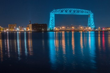 The Aerial Lift Bridge in Duluth, Minnesota is lit teal for Cancer Awareness