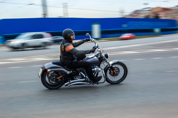 motorcyclist rides at speed on city roads, may 2018, St. Petersburg