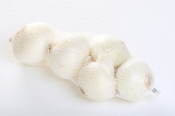 White onion in a grid on a white background.