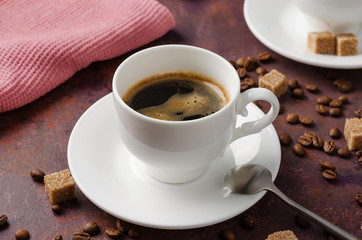 Coffee in cup on dark background