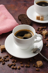 Coffee in cup on dark background