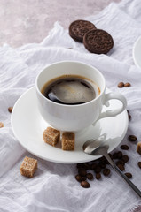 Coffee in cup on light background