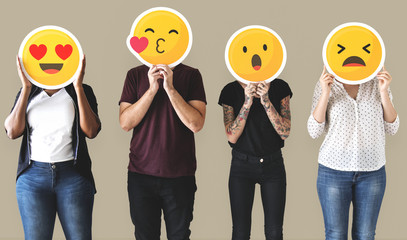 Diverse people covered with emoticons