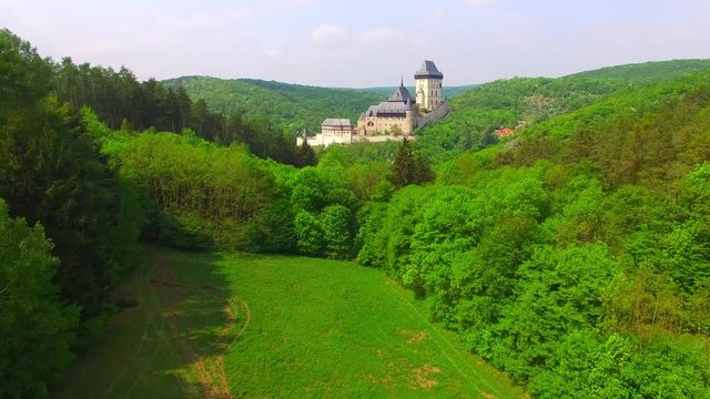 Camera flight around The Karlstejn castle. Royal palace founded King Charles IV. Amazing gothic monument in Czech Republic, Europe. 