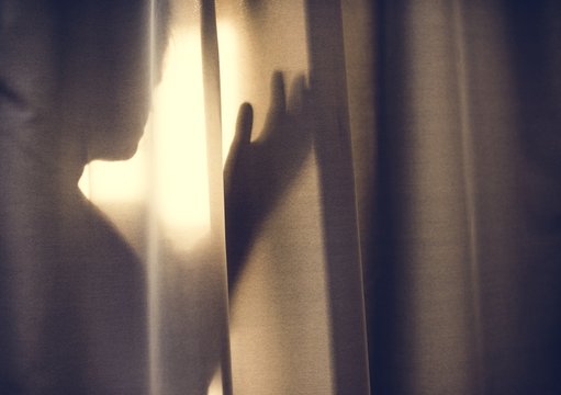 Human Shadow Behind A Curtain