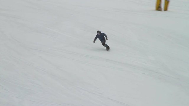 Snowboarder boarding through slow zone