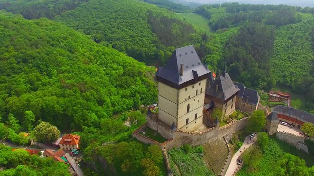 Camera flight around The Karlstejn castle. Royal palace founded King Charles IV. Amazing gothic monument in Czech Republic, Europe. 