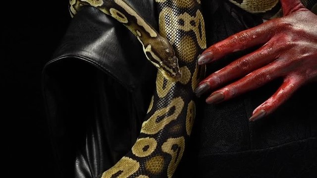 Python and woman with bloody fingers