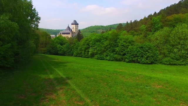 Camera flight around The Karlstejn castle. Royal palace founded King Charles IV. Amazing gothic monument in Czech Republic, Europe. 