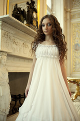 Portrait of a beautiful young victorian lady in white dress