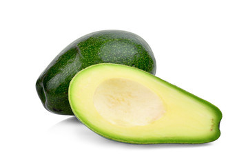 whole and half avocado isolated on white background