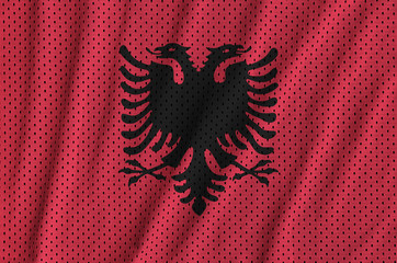 Albania flag printed on a polyester nylon sportswear mesh fabric with some folds