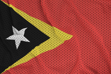 Timor Leste flag printed on a polyester nylon sportswear mesh fabric with some folds