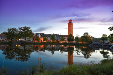 Naklejka premium Altenburg Germany -May 2018: the little pond and arttower in front of the blue summer sky Kunstturm