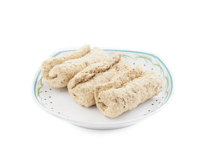 Indian Sweet Gajak Food Also Know As Dry Fruit Roll Isolated on White Background