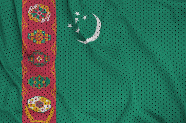 Turkmenistan flag printed on a polyester nylon sportswear mesh fabric with some folds