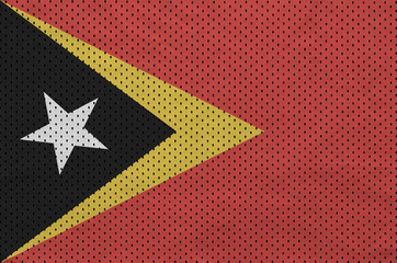 Timor Leste flag printed on a polyester nylon sportswear mesh fabric with some folds