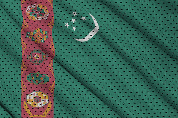 Turkmenistan flag printed on a polyester nylon sportswear mesh fabric with some folds