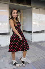 Woman in poodle dress and oxford shoes