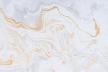 White paper sheet texture background. Flowing colors. Golden and silver fluid color pattern.