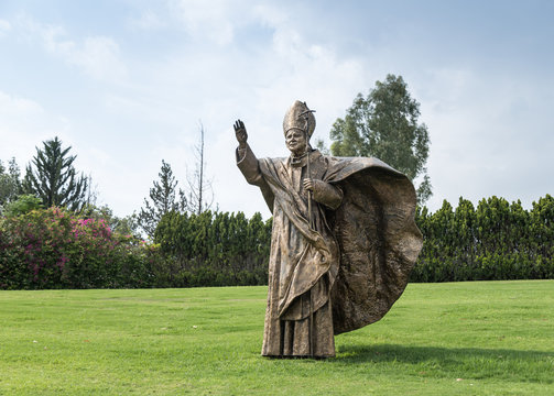 Bronze monument to Pope John Paul II on the lawn in front of the facade of the House of Galilee - Domus Galilaeae - near Vered Hagalil, Israel
