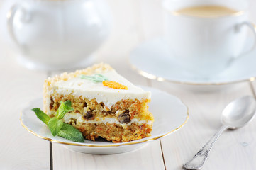 carrot cake slice with mint and coffee