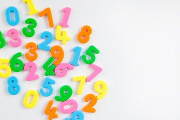 Colorful plastic numbers on a white background