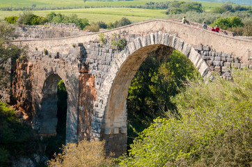 Fototapeta na wymiar bridge over the river Fiora near the castle of Vulci
