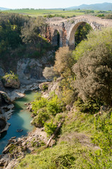 Fototapeta premium bridge over the river Fiora near the castle of Vulci