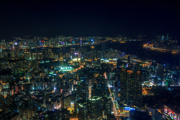 Fototapeta na wymiar Cityscape of Kowloon with colourful lights in futuristic style