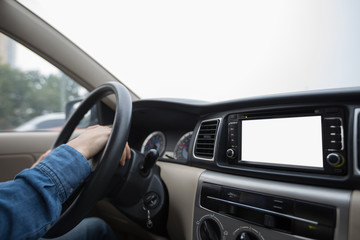 Hands on wheel driving car in city