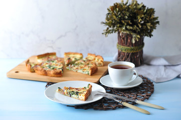 piece of French quiche pie and Cup of tea