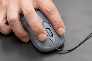 Mouse from computer in hand on black background