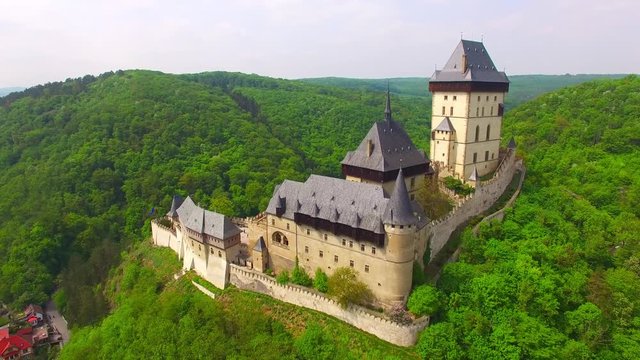 Camera flight around The Karlstejn castle. Royal palace founded King Charles IV. Amazing gothic monument in Czech Republic, Europe. 
