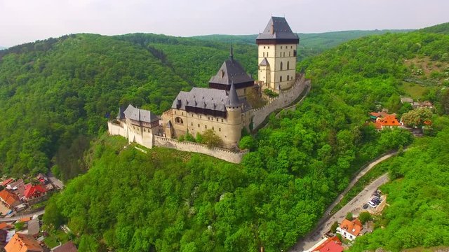 Camera flight around The Karlstejn castle. Royal palace founded King Charles IV. Amazing gothic monument in Czech Republic, Europe. 