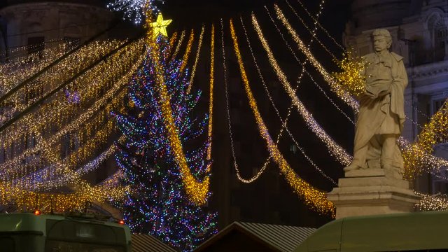 Gheorghe Lazar statue near a Christmas tree