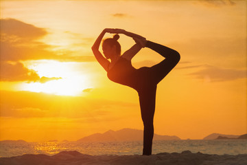 Yoga girl on the beach