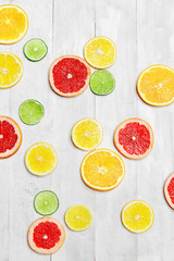 Slices Of Fresh Citrus Fruits On White Background