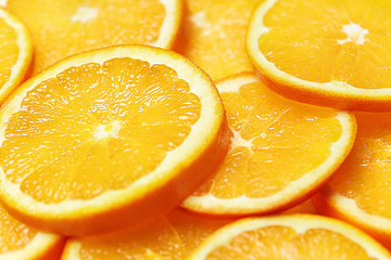 Fototapeta na wymiar Fresh Orange Slices Background. Top View.