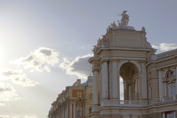 Old Opera and Ballet theatre in Europe, Ukraine, Odessa, with sunshine and blue cloudy sky.
