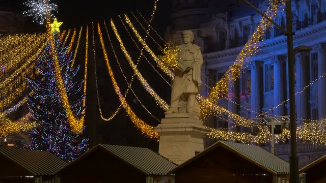 Gheorghe Lazar sculpture near a Christmas tree