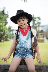 little girl in cowboy outfit