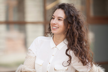 Happiness concept - happy woman having fun on city street during summer