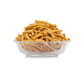 Sev is a popular Indian snack food consisting of small pieces of crunchy noodles made from chickpea flour paste, which are seasoned with turmeric, cayenne, and ajwain before being deep-fried in oil.