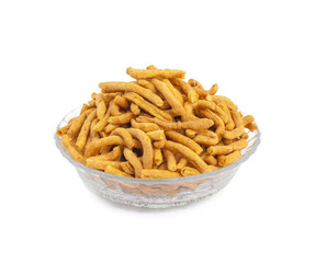 Sev is a popular Indian snack food consisting of small pieces of crunchy noodles made from chickpea flour paste, which are seasoned with turmeric, cayenne, and ajwain before being deep-fried in oil.