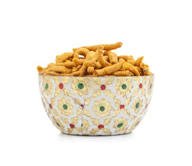 Sev is a popular Indian snack food consisting of small pieces of crunchy noodles made from chickpea flour paste, which are seasoned with turmeric, cayenne, and ajwain before being deep-fried in oil.