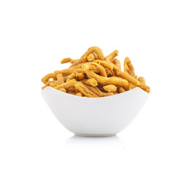 Sev is a popular Indian snack food consisting of small pieces of crunchy noodles made from chickpea flour paste, which are seasoned with turmeric, cayenne, and ajwain before being deep-fried in oil.