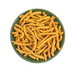 Sev is a popular Indian snack food consisting of small pieces of crunchy noodles made from chickpea flour paste, which are seasoned with turmeric, cayenne, and ajwain before being deep-fried in oil.