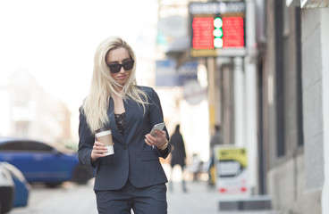 Fototapeta na wymiar A beautiful young business woman walking outdoors