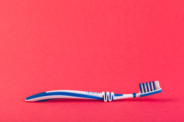 Toothbrush on red background